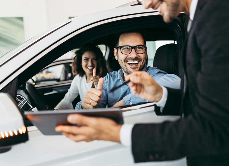 Customers test driving a car